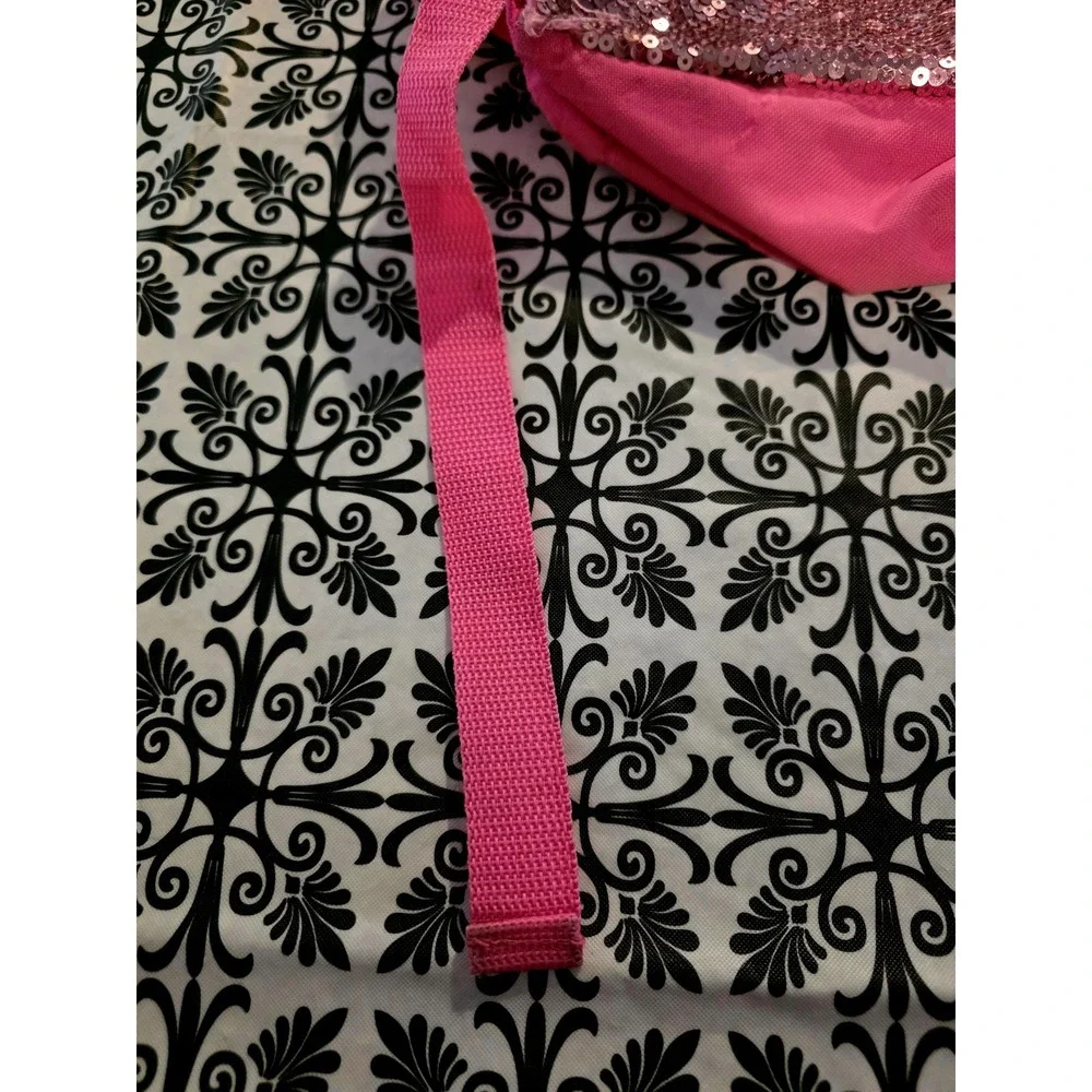 Bright pink sequin backpack. Gold Cat ears matching gold. Good. Few Minor Flaws.
